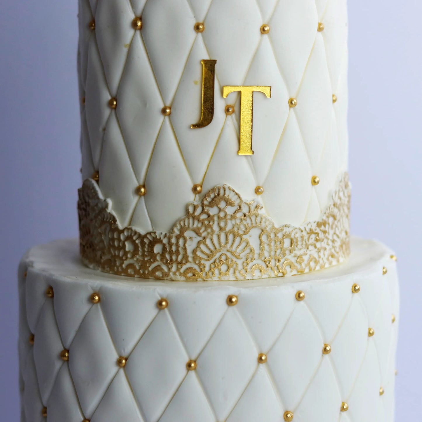 Two-Tier Golden Rings Engagement Cake